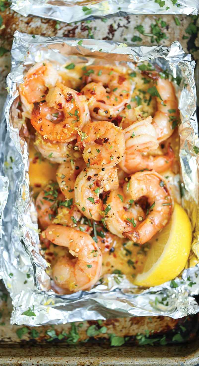 A foil packet filled with shrimp tossed in lemon, butter, garlic, fresh herbs, and red pepper flakes.