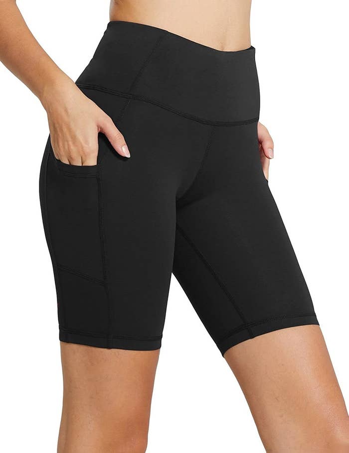 model wearing black high-rise leggings with pockets
