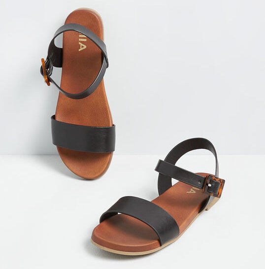 The faux leather sandals in black. 