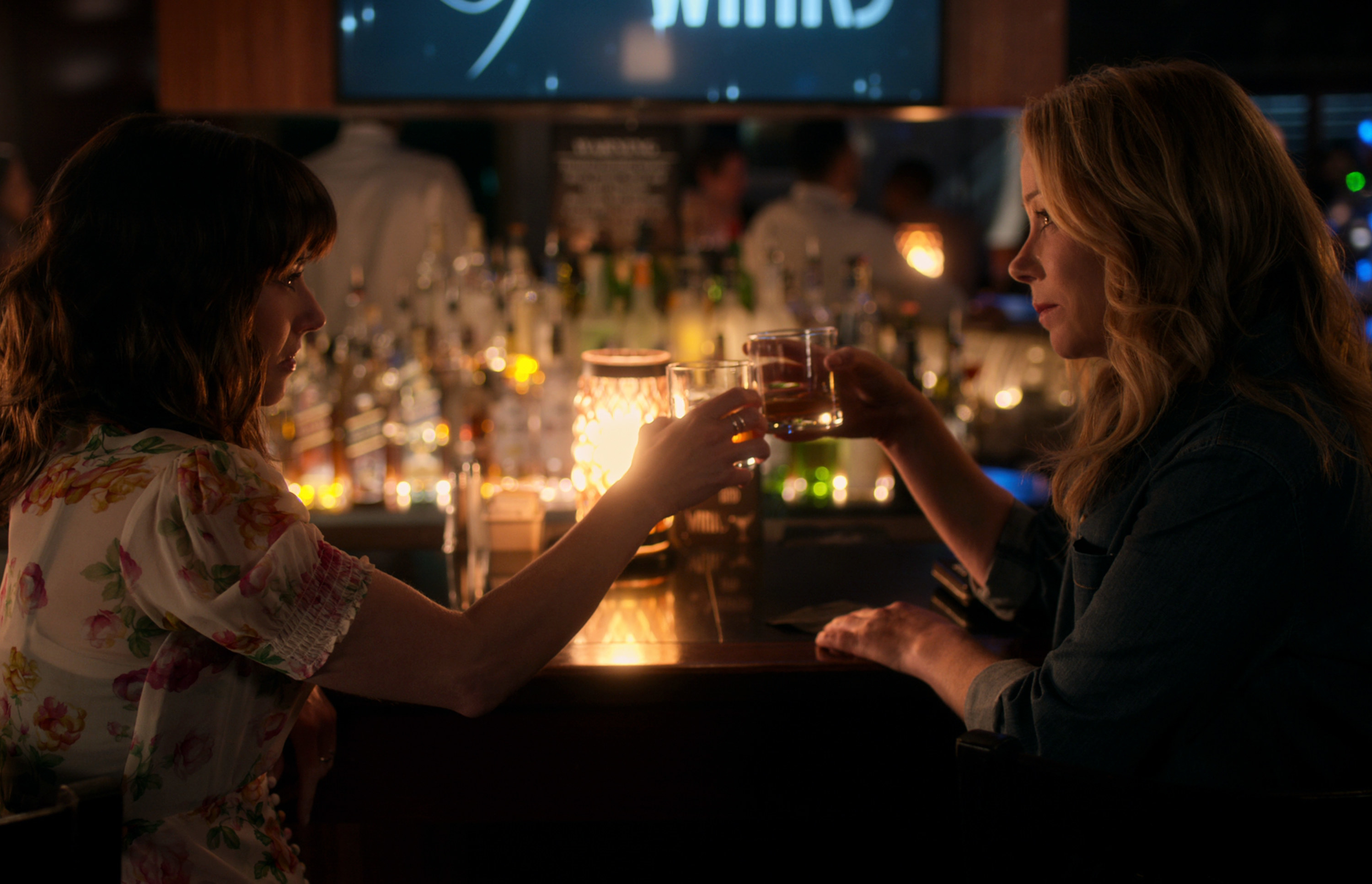 Jen and Judy drinking together at a bar