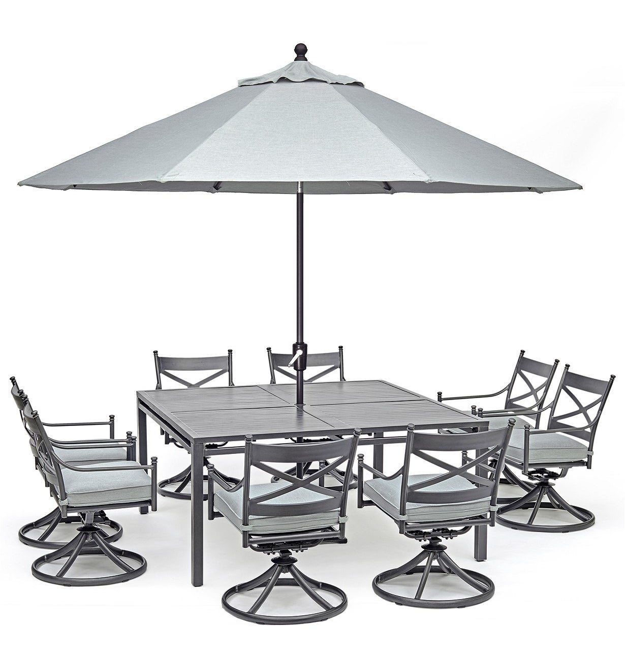 silver table with eight silver swivel chairs and a matching umbrella