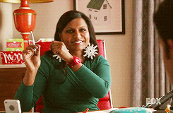 Mindy from the Mindy Project dancing at her desk 