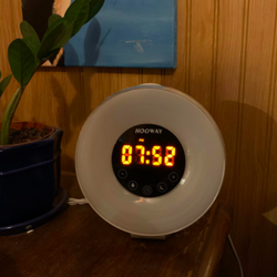 A reviewer photo of a super-bright bedside clock