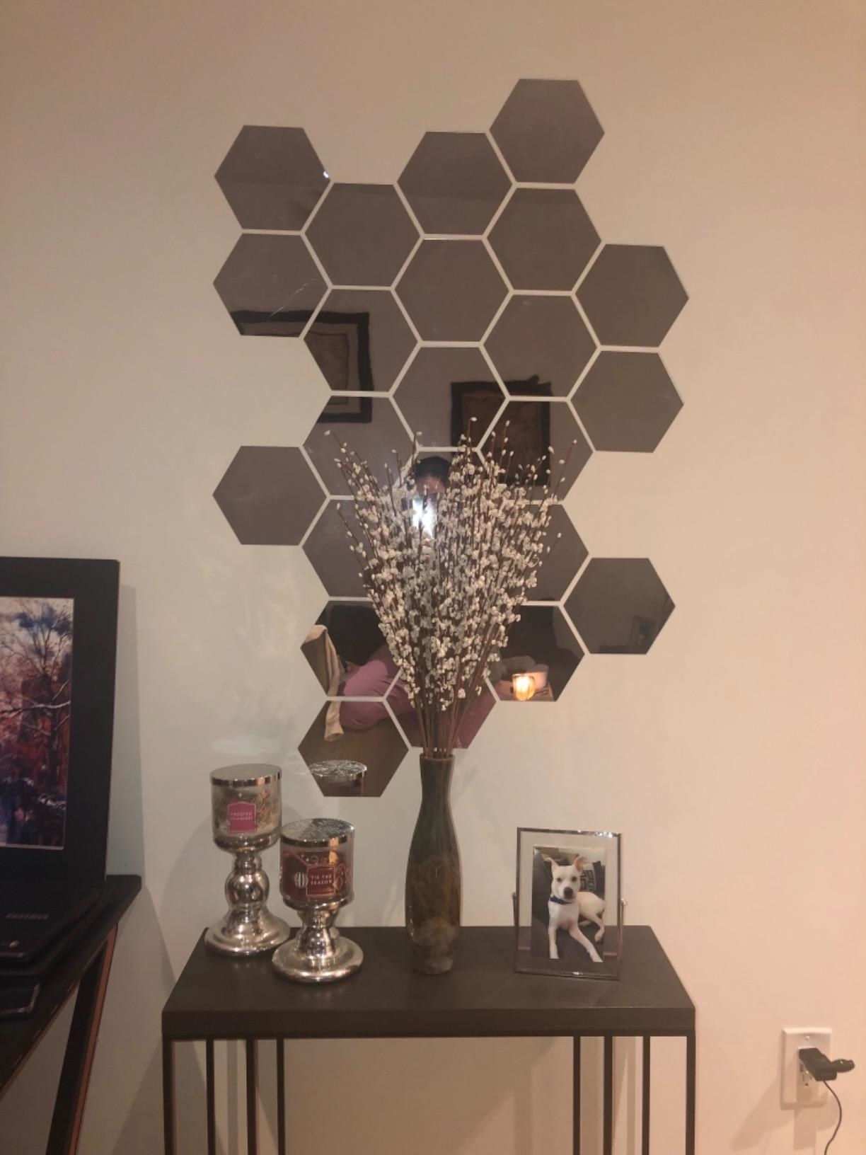A reviewer&#x27;s set of hexagon-shaped mirrors on the wall