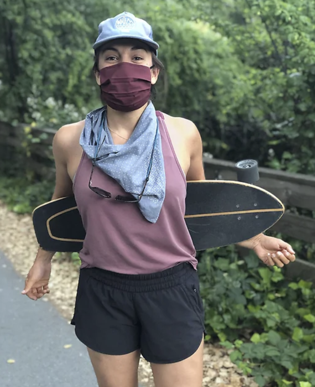 A model in athletic gear and a face mask
