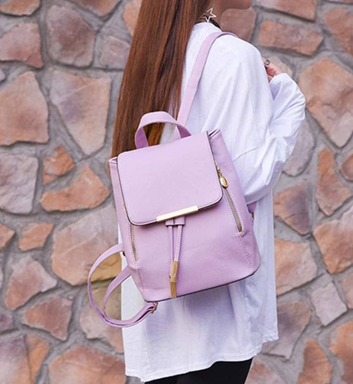 A person wearing the backpack