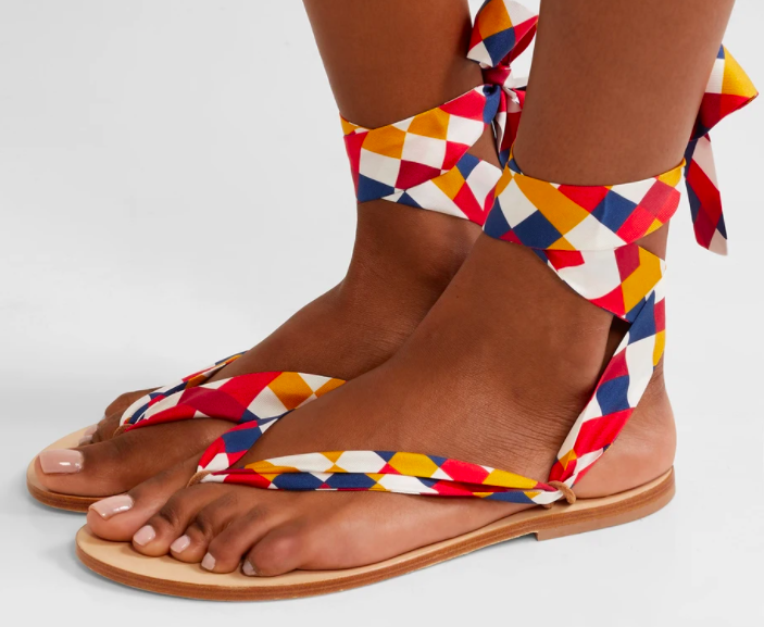 A model wearing the Eres Mosaic Nupie suede-trimmed printed silk-twill sandals.
