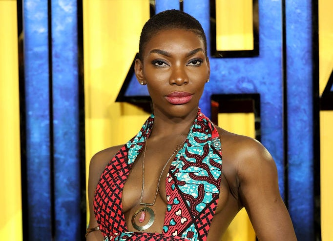 A profile photo of Michaela Coel posed on the red carpet.