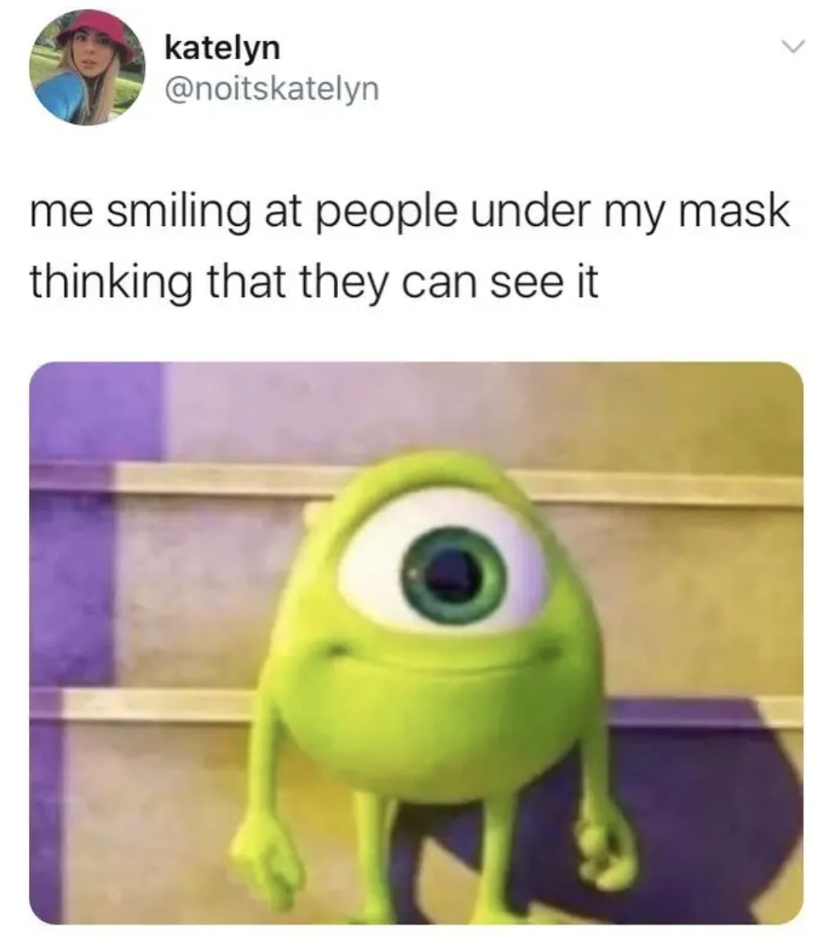 Picture of a little green monster smiling with the caption "me smiling at people under my mask thinking that they can see it"
