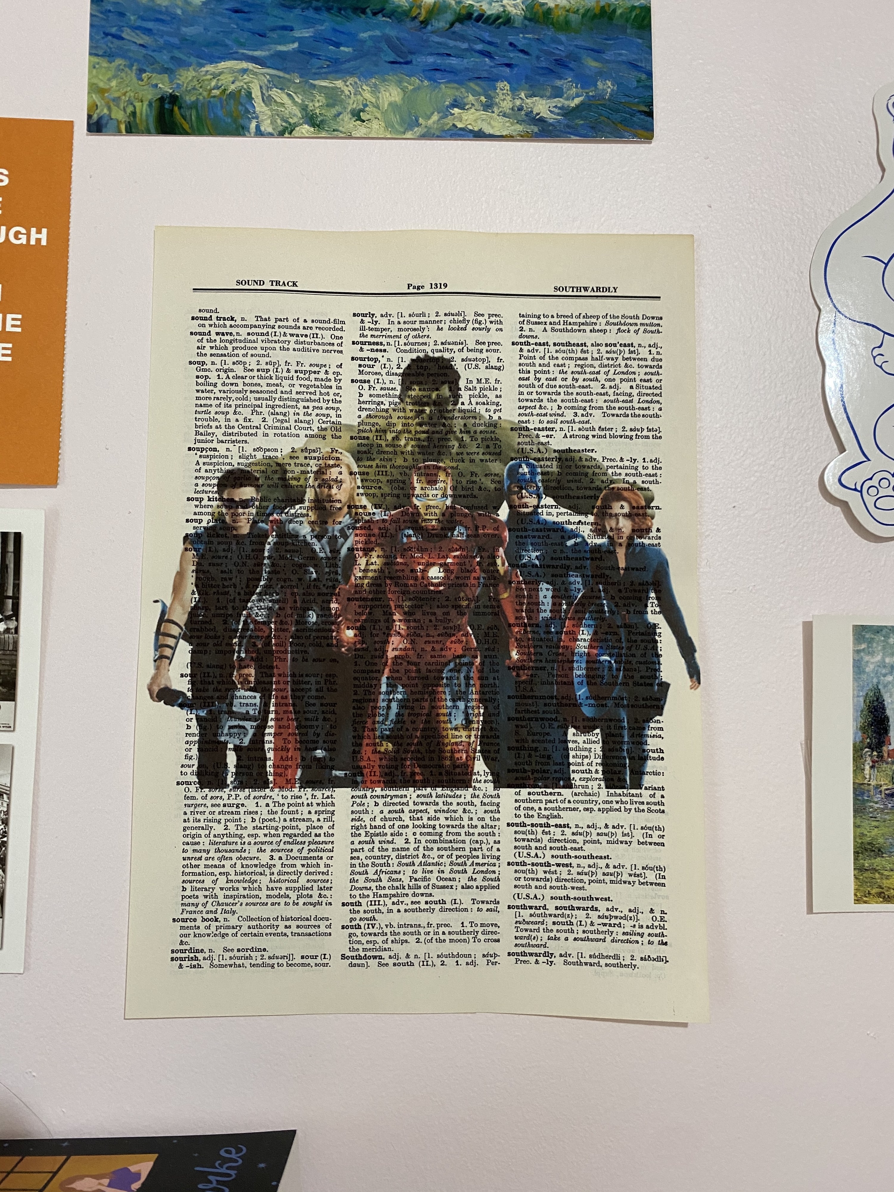 a page of the dictionary with an overlaid print of the avengers on it