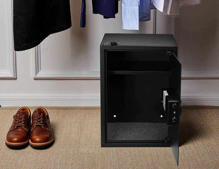 An open safe kept on the ground.
