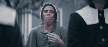 GIF of a woman coughing