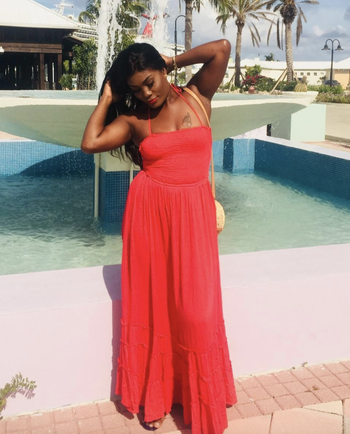 reviewer wearing the red dress 