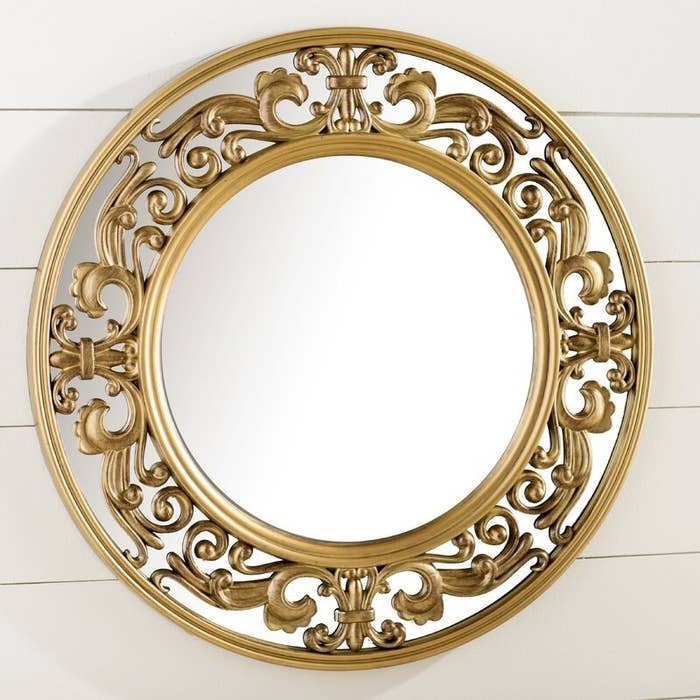 The mirror with a filigree frame