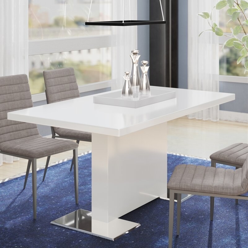 A white rectangular table with a glossy look and a single rectangle as a base