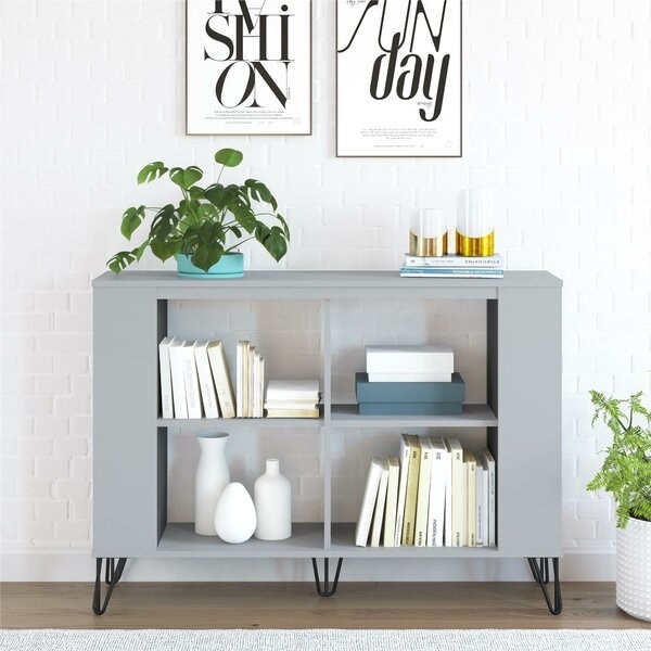 The grey bookcase with hairpin legs and four open shelves