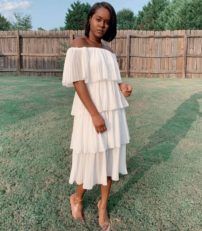 reviewer wearing the white midi dress
