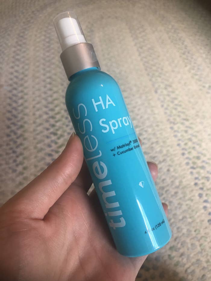 hand holding the bottle of spray
