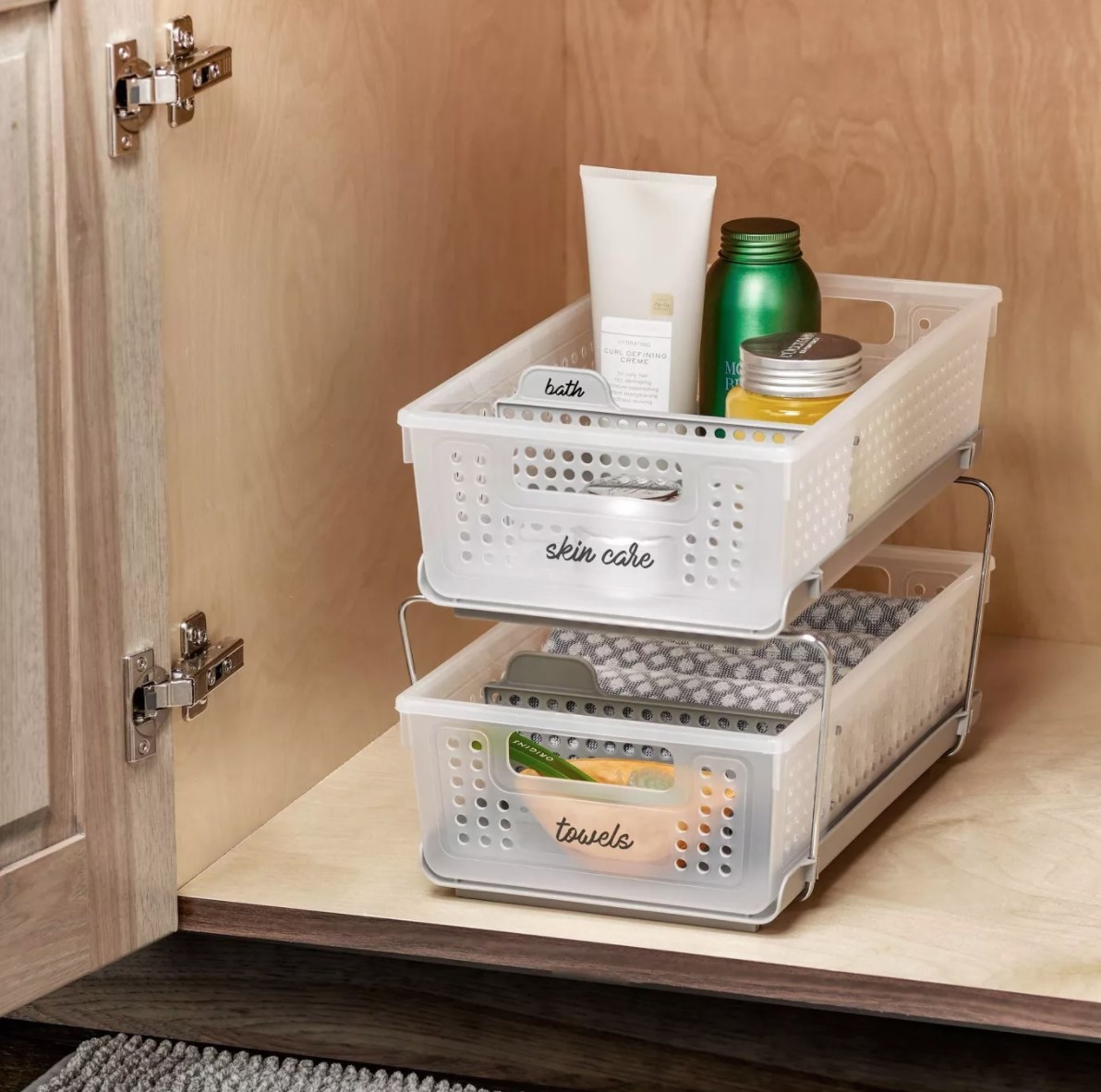 Two small pull-out, plastic drawers that say &quot;skin care&quot; and &quot;towels&quot; on them