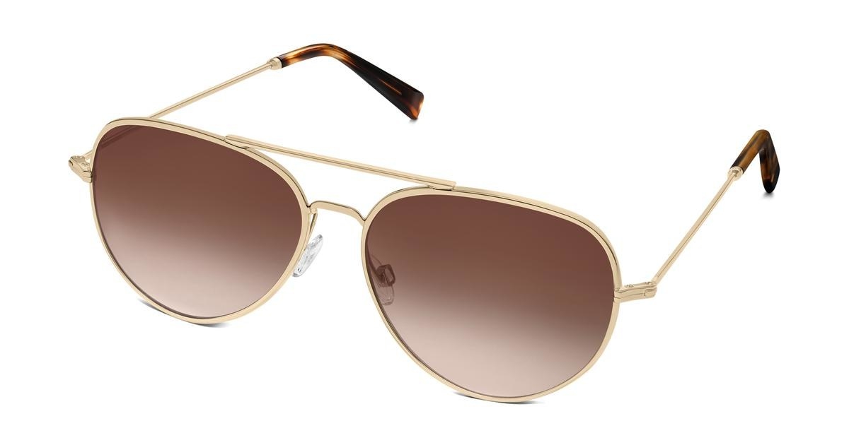 The sunglasses with gold frames and brown lenses