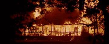 The Strode residence still ablaze.