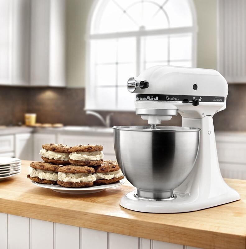 The KitchenAid stand mixer in white with an attached bowl