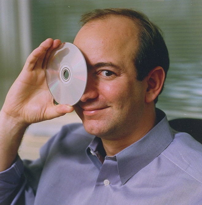 Now Jeff Bezos is holding a CD to his eye