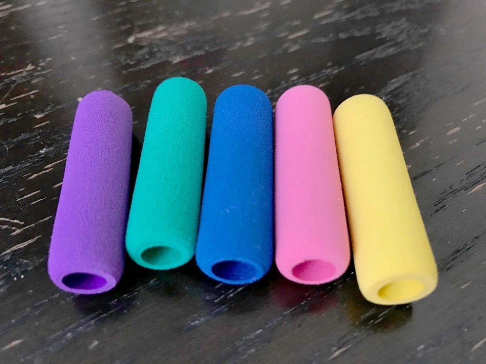 Plush pencil grips in rainbow colors