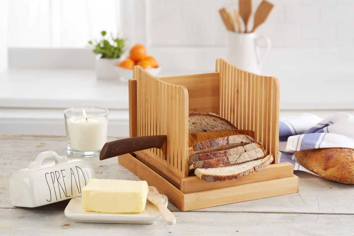 The foldable bread slicer with bread inside. 