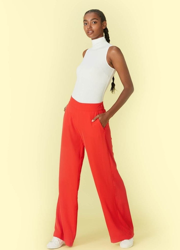 model in red wide-legged pants with elastic waist