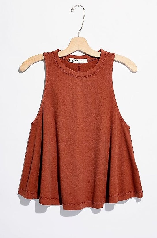 rust orange tank with large arm holes that&#x27;s wider at the bottom