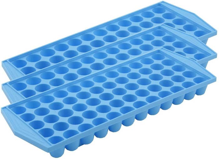 A set of three ice trays that make small ice nuggets