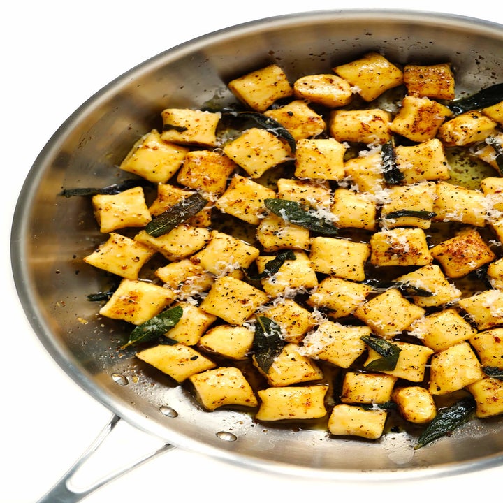 Boiled gnocchi tossed in butter and sage in a sauce pan.