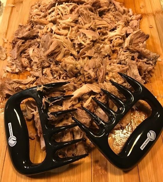 Reviewer's picture of the claws with a pile of pulled pork