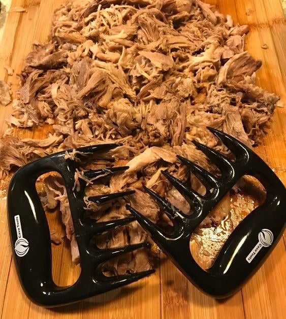 Reviewer&#x27;s picture of the claws with a pile of pulled pork 