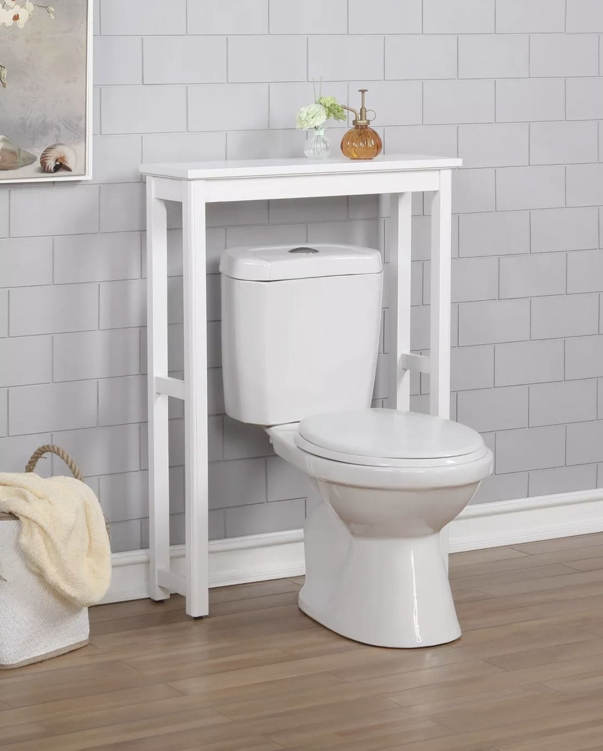 The white shelving over a toilet 