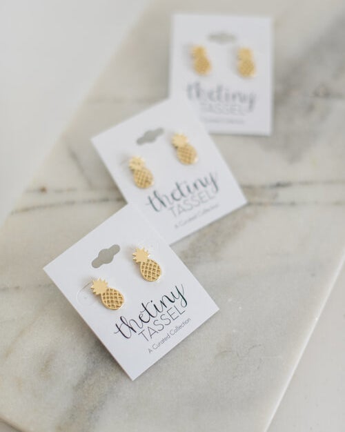 The gold pineapple-shaped studs