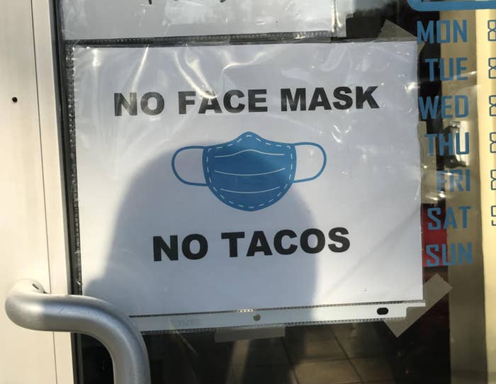 Sign reading No face mask no tacos