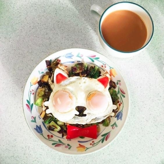 Reviewer's picture of their cat-shaped eggs after using the mold
