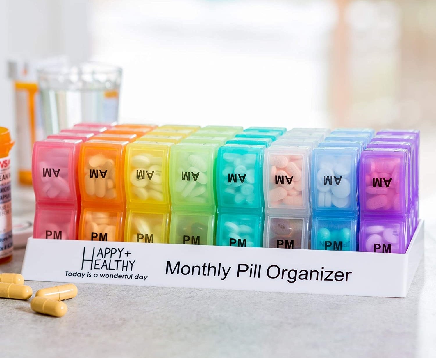 The monthly pill organizer filled with capsules