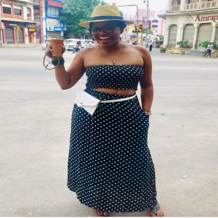 reviewer wearing the set in black with white polka dots 