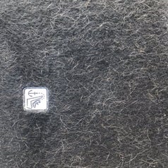 Reviewer photo of their carpets after vacuuming showing that there's still a lot of white dog fur visible