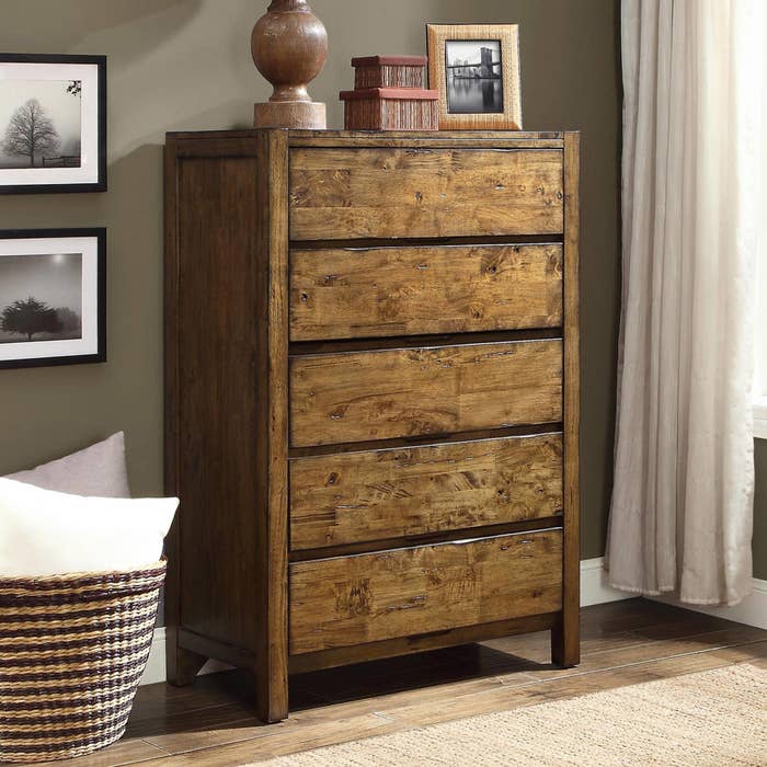 A five-drawer dresser in a weathered brown stain 