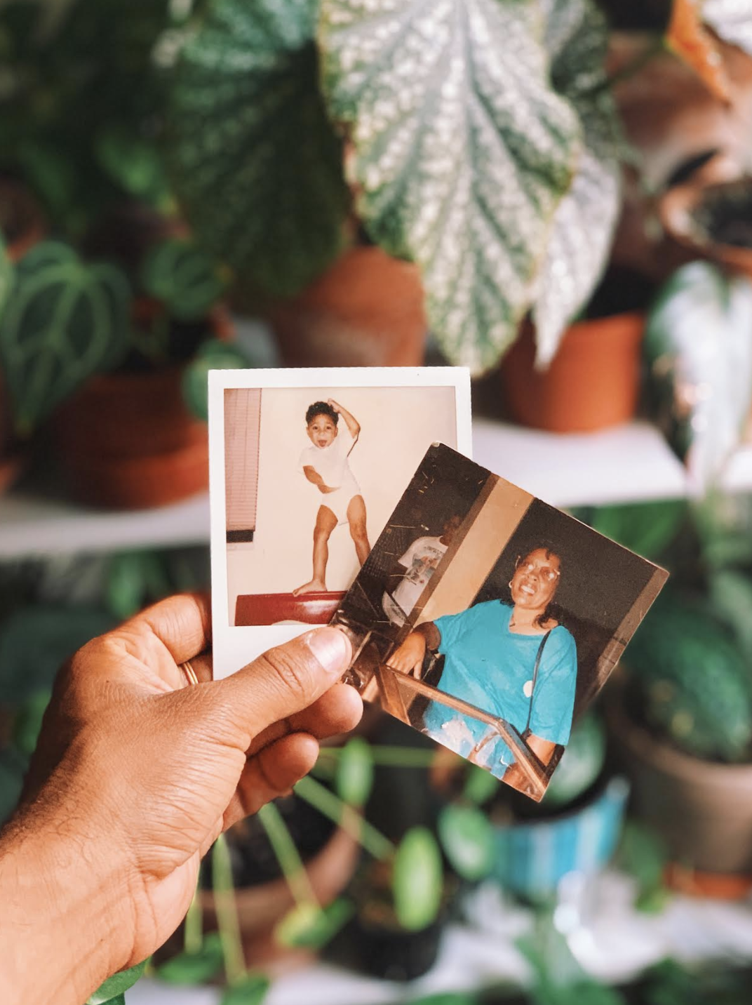 Griffin holding a photo of their grandmother. 