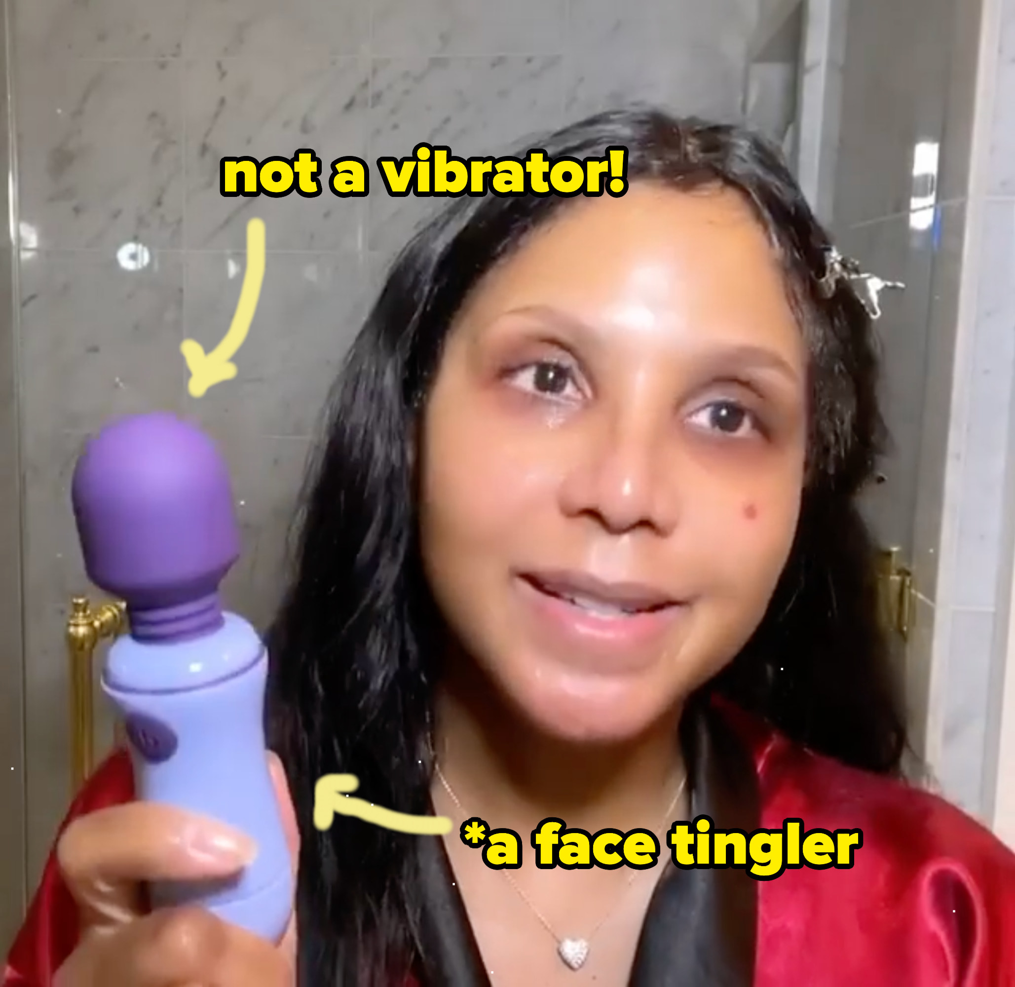 Toni Braxton holds a vibrator