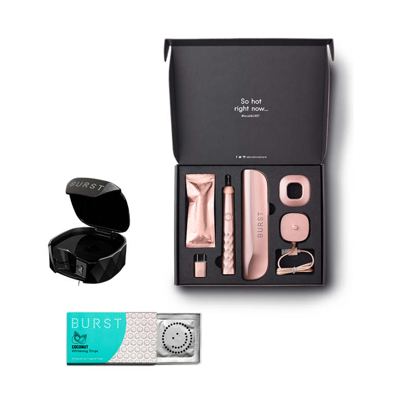 whitening strips, a case of floss, and a rose gold toothbrush set with a charger