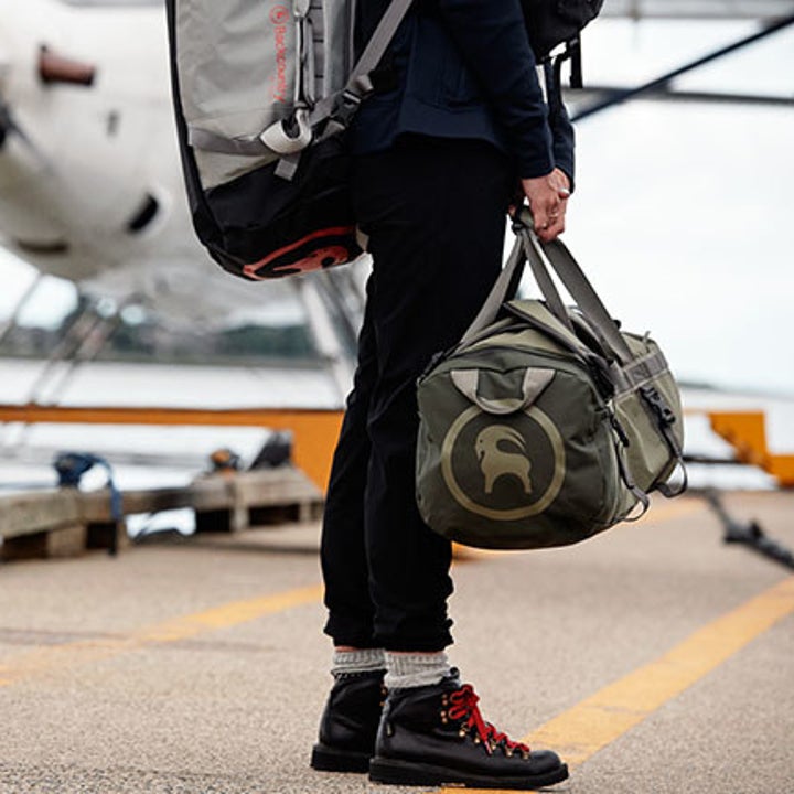 model holding the bag in green