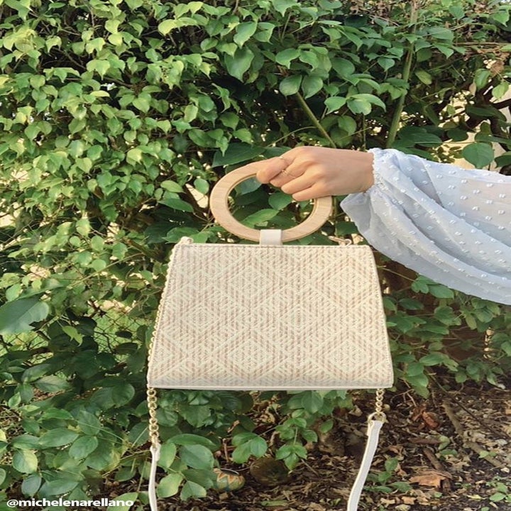 Beige threaded geometric structured bag with round wooden handle and cross-body strap