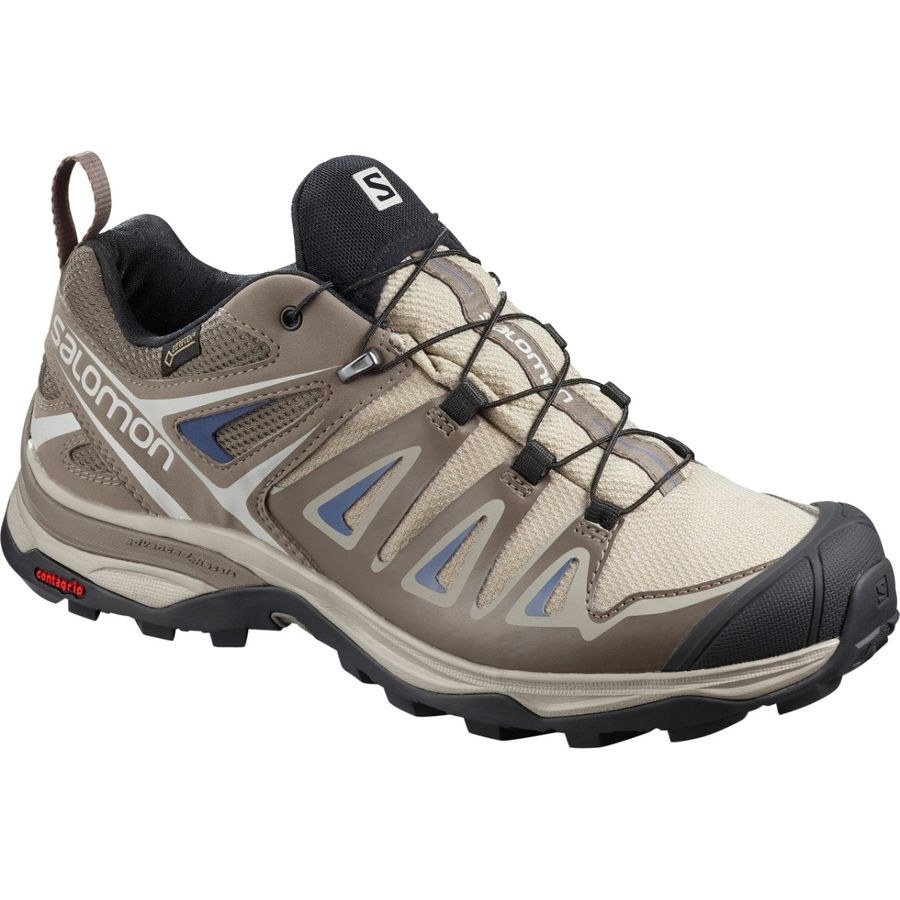 tan hiking shoes with thick grippy soles and a thick black rubber toe