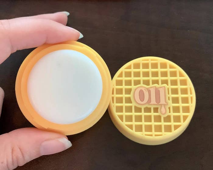 reviewer photo of the waffle-inspired lip balm labeled &quot;011&quot; 